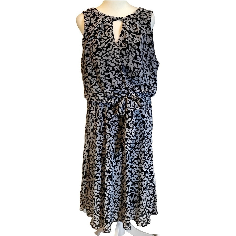 Karin Steven’s sleeveless black/white patterned lined dress. Tie at neck & waist